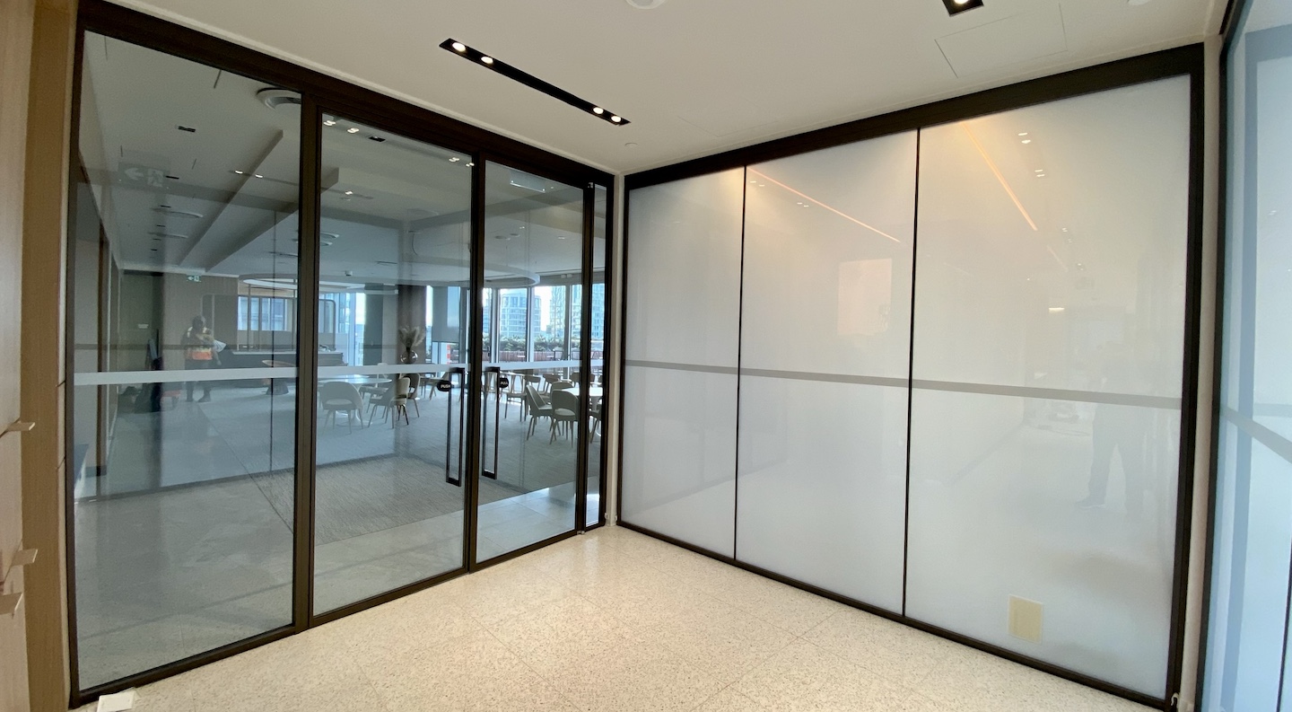 A look at the recent privacy glass installation for a client's Canadian meeting room suites.